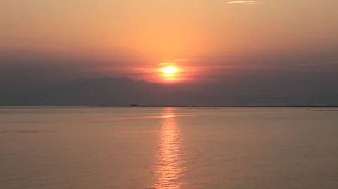 Sunset over the mountains seen from sea Video stock 30704021