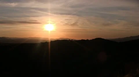 SUNSET OVER MOUNTAINS SLOW PAN Stock Footage 10710938
