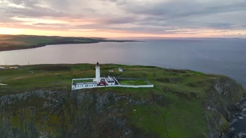 Sunset over  Mull of Galloway Lighthouse, Galloway, Mainland Scotland, UK 動画素材 244798473