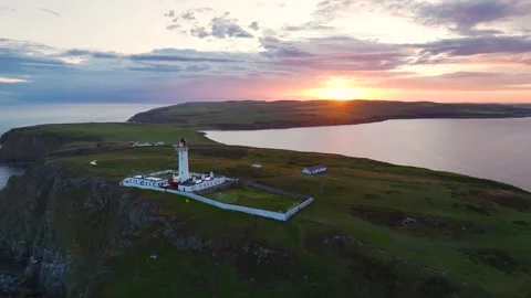 Sunset over Mull of Galloway Lighthouse, Galloway, Mainland Scotland, UK Stock Footage 244811304