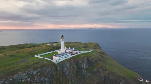 Sunset over Mull of Galloway Lighthouse, Galloway, Mainland Scotland, UK 動画素材 244811313