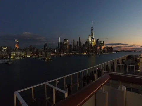 Sunset over New York city and tourists on the ship enjoying in the view Stock Footage