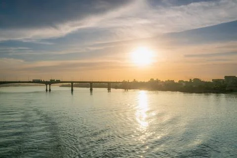 Sunset Over the Nile River Bridge in Luxor with Cityscape. Stock Photos