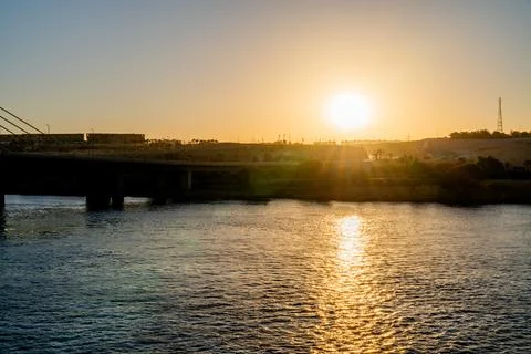 Sunset Over Nile River Bridge in Aswan, Egypt Stock Photos
