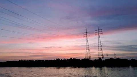 Sunset Over the Nile River with Power Lines and Towers in Egypt. Stock Footage 302573675