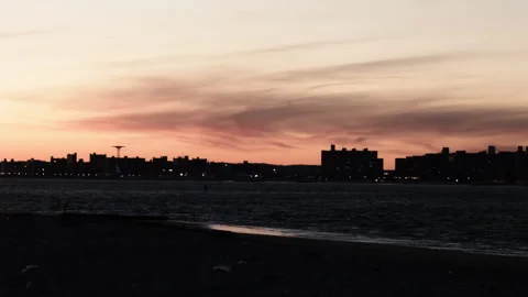 Sunset over NYC and Ocean, view from Rockaway Beach Park Stock Footage 185097254