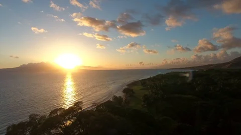 Sunset over ocean and mountains Stock Footage 86337240