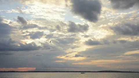 Sunset over ocean bay time lapse with 3D-like cloud movement wide angle HD 1080 Stock Footage 27466188