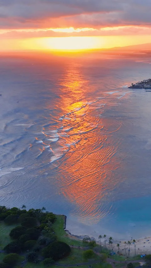 Sunset over ocean with beach park and golden reflections. Vertical video. Stock Footage 319760463