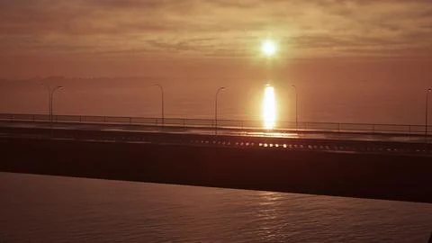 Sunset Over Ocean With Bridge in Foreground. beautiful sunset Stock Illustration