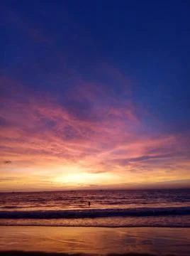 Sunset over the ocean with clear sky weather Stock Photos