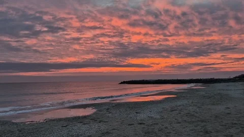 Sunset over the ocean coastline, orange clouds Stock Footage 300308212