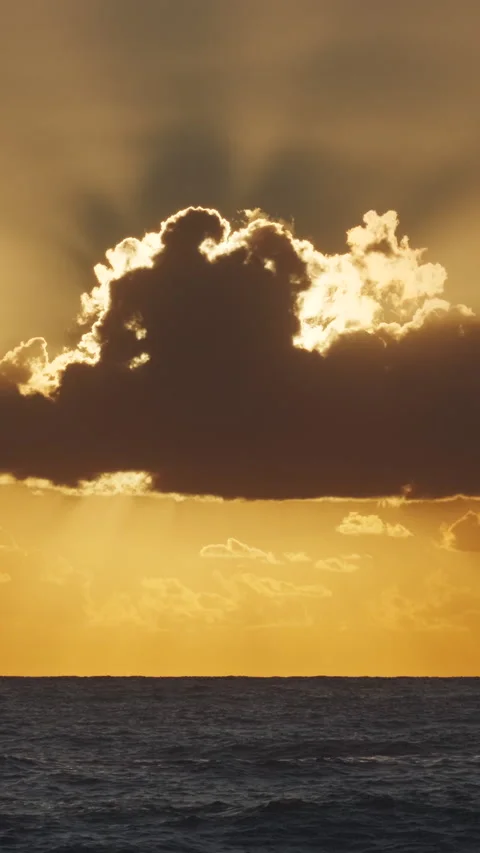 Sunset over ocean with dramatic clouds at dusk Stock Footage 306785051