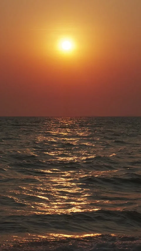 Sunset over ocean with dramatic clouds at dusk Stock Footage 306788640
