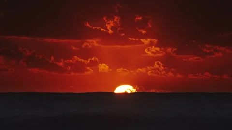 Sunset over ocean with dramatic clouds at dusk Stock Footage 308881792