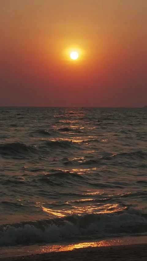 Sunset over ocean with dramatic clouds at dusk Stock Footage 309391191