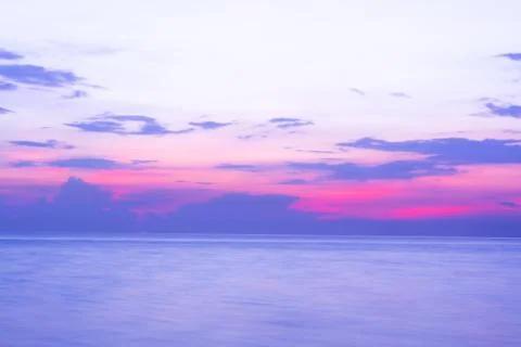 Sunset over the ocean with dramatic cloudscape. Stock Photos