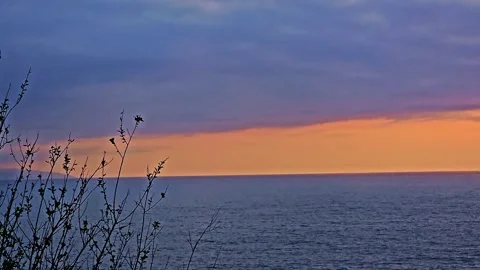 A sunset over the ocean Video stock 272777824