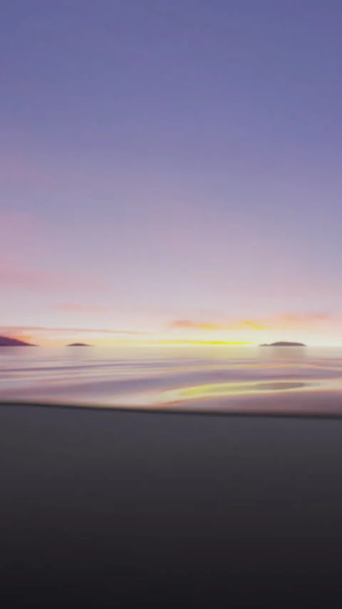 Sunset over ocean with island in distance and gentle waves on shore Stock Footage 340262522
