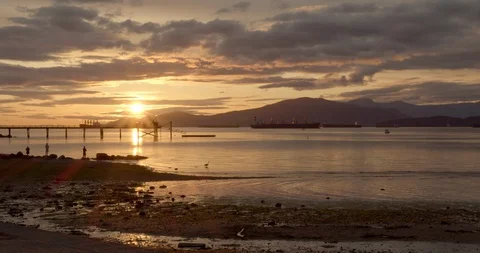 Sunset over the Ocean with Mountains Video stock 129860520