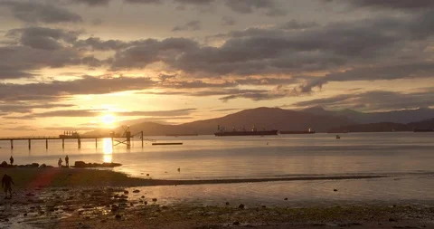 Sunset over the Ocean with Mountains Video stock 129860544