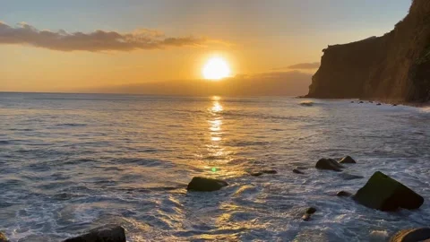 Sunset over the ocean near the mountains on Madeira Island Stock Footage 332716015
