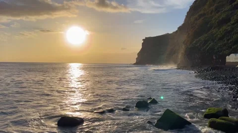 Sunset over the ocean near the mountains on Madeira Island, Madalena do Mar Stock Footage 332716071