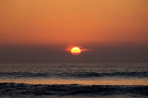 Sunset over the ocean Stock Photos