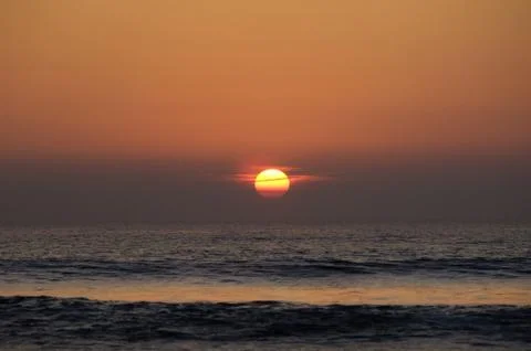 Sunset over the ocean Stock Photos