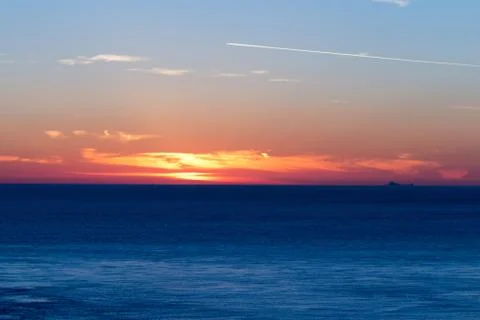 Sunset over the ocean Stock Photos