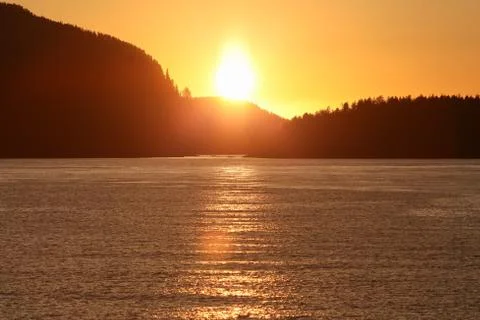 Sunset over ocean Stock Photos