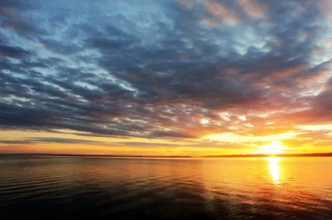 Sunset over ocean Stock Photos