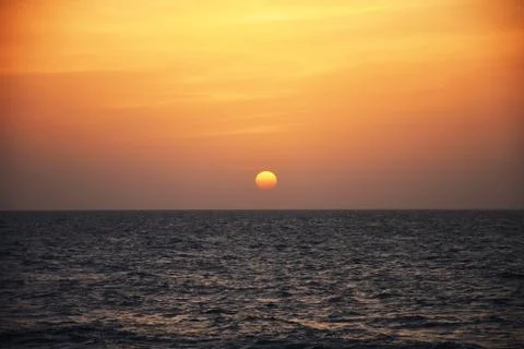 Sunset over the ocean Stock Photos