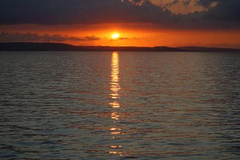 Sunset over the ocean Stock Photos