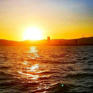 Sunset over the ocean Stock Photos