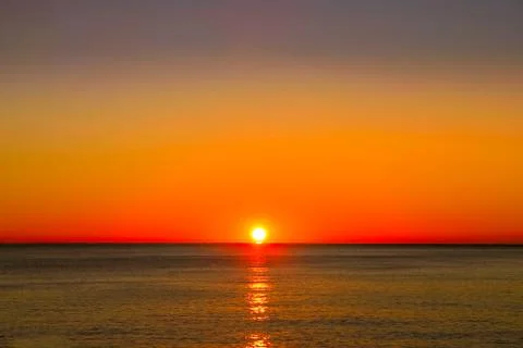 A sunset over the ocean Stock Photos