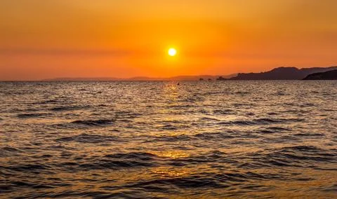 A sunset over the ocean Stock Photos