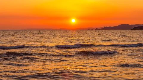 A sunset over the ocean Stock Photos