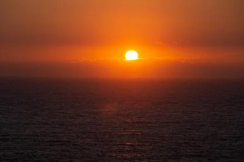 Sunset over the ocean Stock Photos