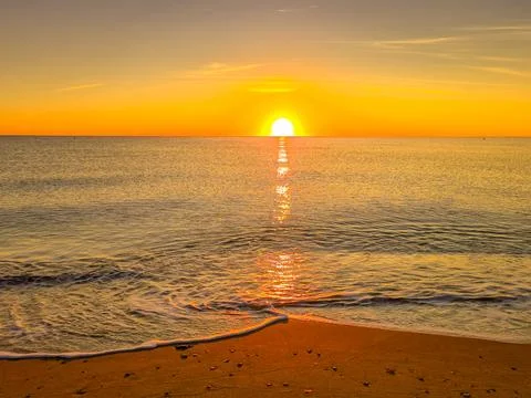 A sunset over the ocean Stock Photos