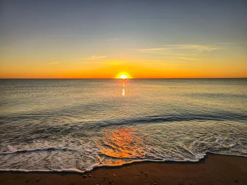 A sunset over the ocean Stock Photos