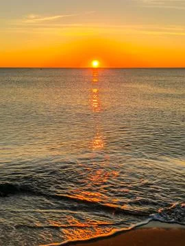 A sunset over the ocean Stock Photos