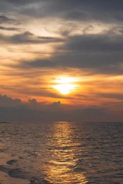 Sunset Over the Ocean with Reflective Water Stock Photos