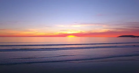 Sunset over ocean. Rise up and towards the Horizon. 4k Aerial Stock Footage 145191243