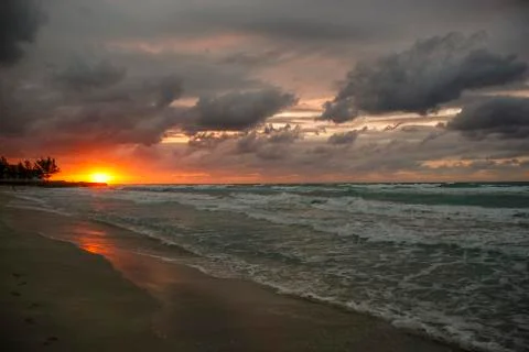 Sunset over the ocean, sun, waves, beach Stock Photos