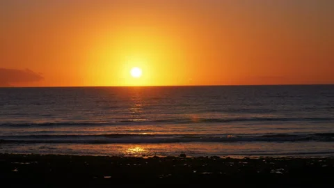 Sunset over the ocean time lapse in 4K Stock Footage 94396513