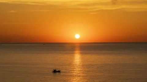 Sunset Over The Ocean Time Lapse. The Evening Sun at The Golden Hour Sets Over Stock Footage 238800901
