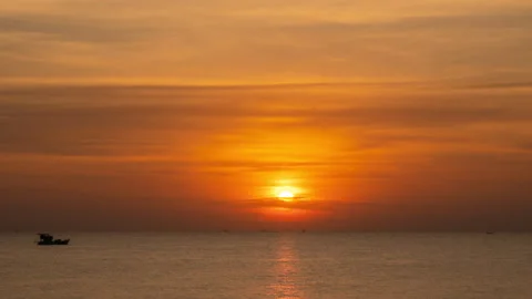 Sunset Over The Ocean Time Lapse. The Evening Sun at The Golden Hour Sets Over Video stock 270299461