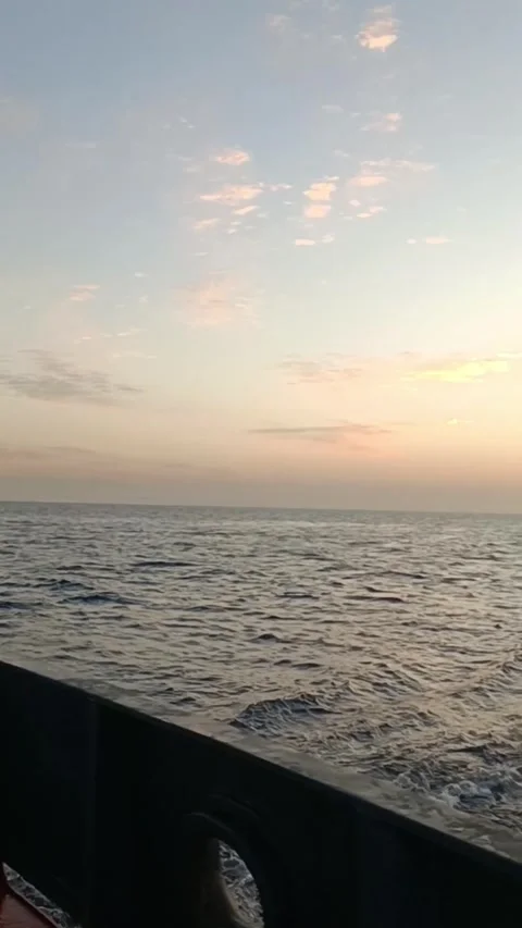 Sunset over the ocean view from a cargo ship deck Video stock 335835878