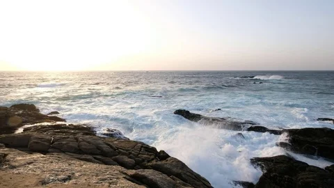 Sunset over the ocean with a view of the mountains Stock Footage 81957785